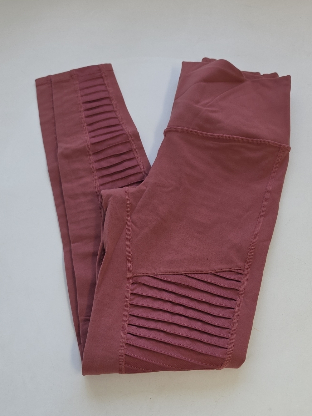 These are Alo Yoga High-Waist Moto Leggings featuring quilted detailing.